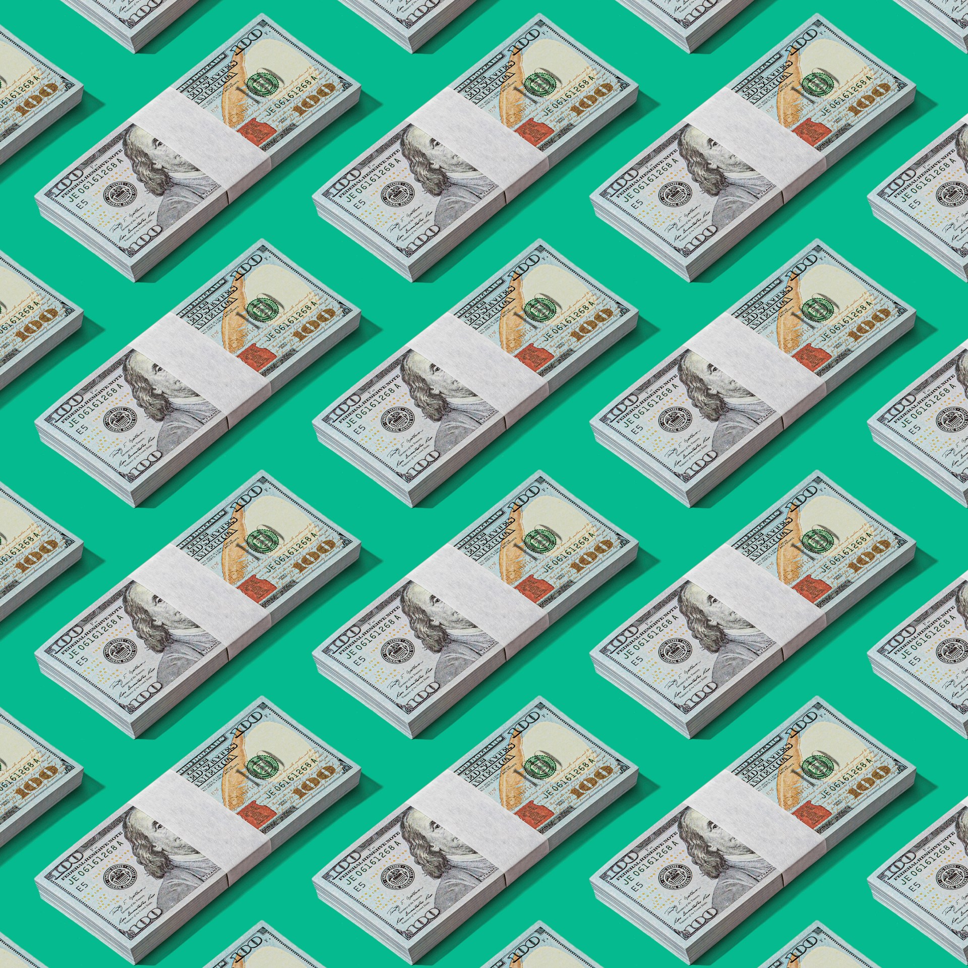 money laying evenly on a green background.